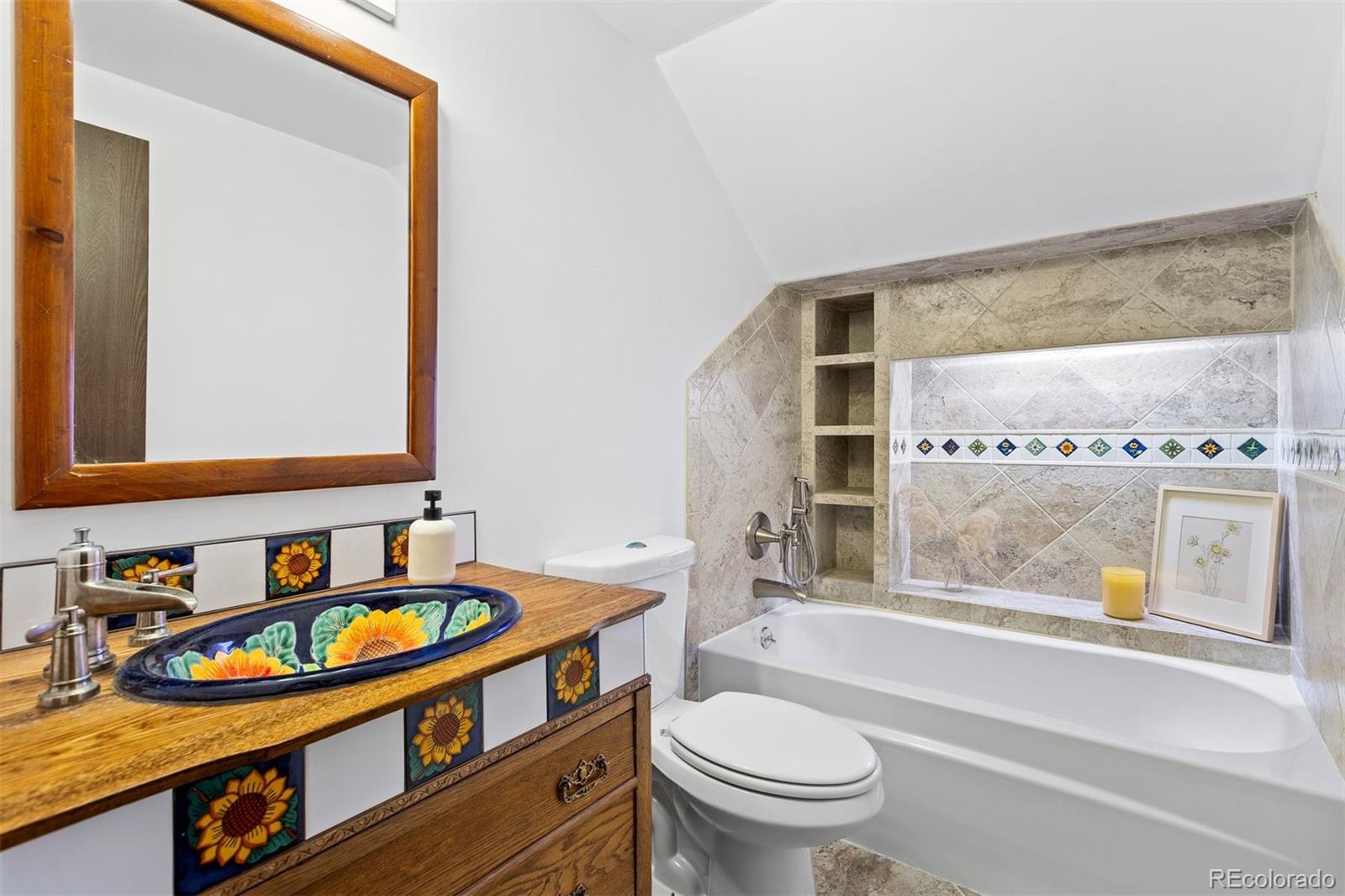 616 South Pine Drive Bailey, CO 80421 - Photo 33 of 50 a bathroom with a granite countertop sink and a large mirror