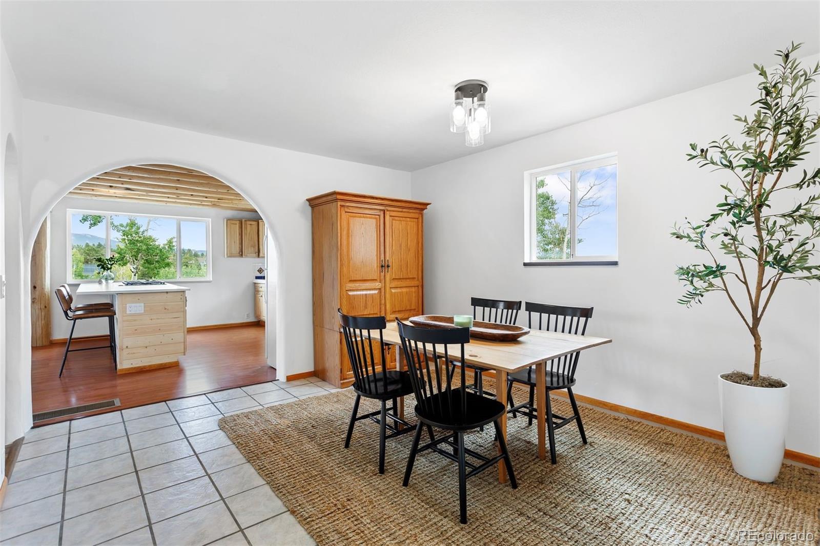 616 South Pine Drive Bailey, CO 80421 - Photo 9 of 50 a view of a dining room with furniture window and wooden floor