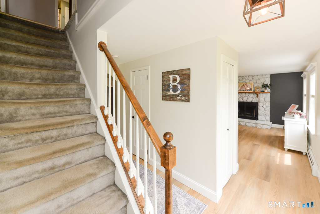 109 Harrison Lane Bethlehem, CT 06751 - Photo 3 of 28 a view of entryway and hall with wooden floor