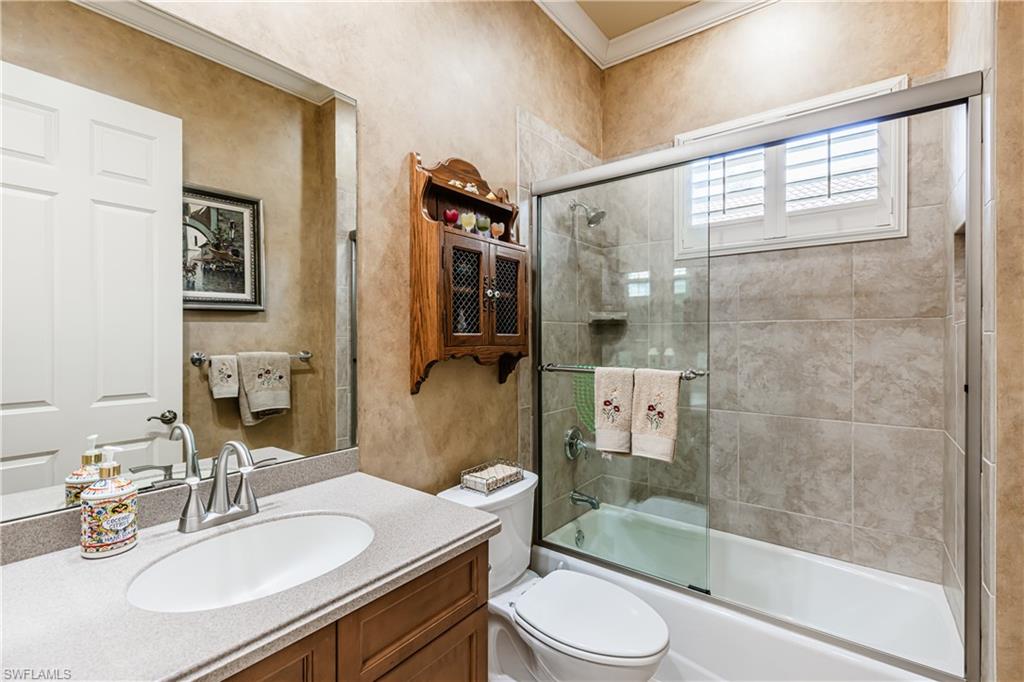 20174 Markward Crossing Estero, FL 33928 - Photo 14 of 30 a bathroom with a sink a toilet and shower