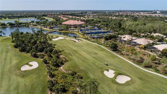 a view of a swimming pool with a lot of trees in the background