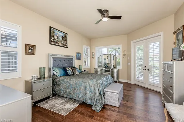 a bedroom with a bed couch and a window