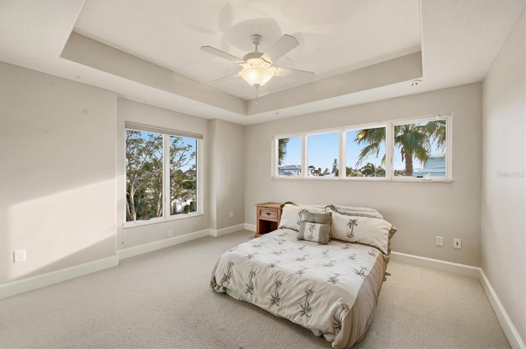 761 Norton Street Longboat Key, FL 34228 - Photo 47 of 66 a bedroom with a large bed and a window