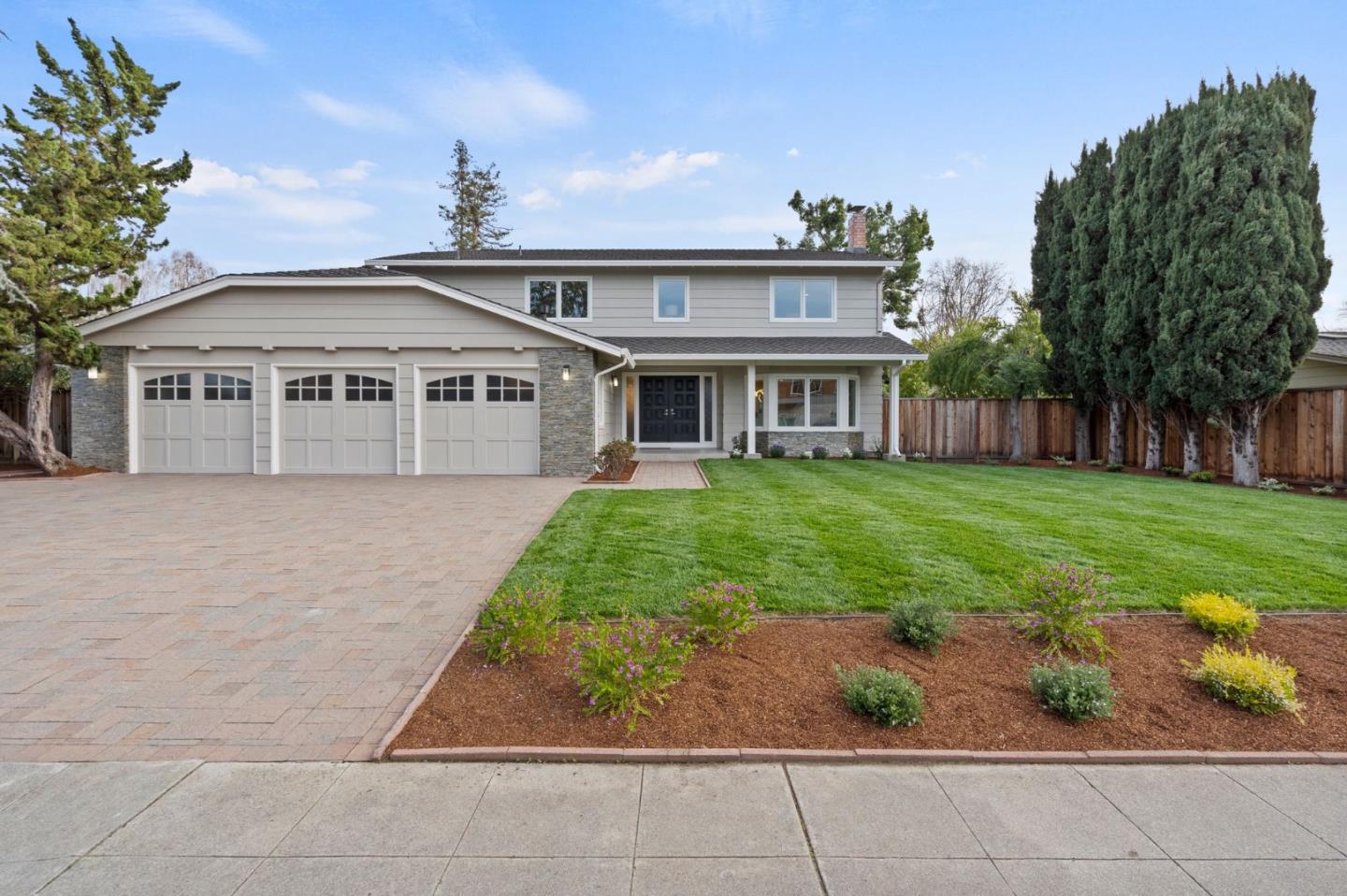 389 Bryant Avenue Mountain View, CA 94040 - Photo 2 of 61 a front view of a house with a garden and plants