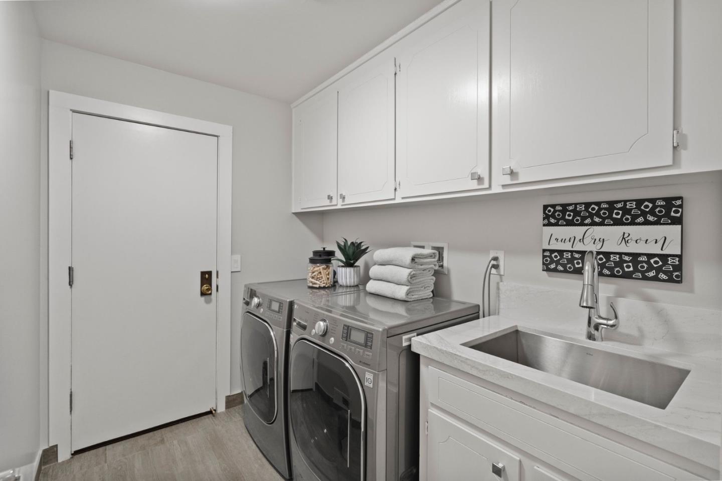 389 Bryant Avenue Mountain View, CA 94040 - Photo 21 of 61 a view of a sink and washer in a kitchen