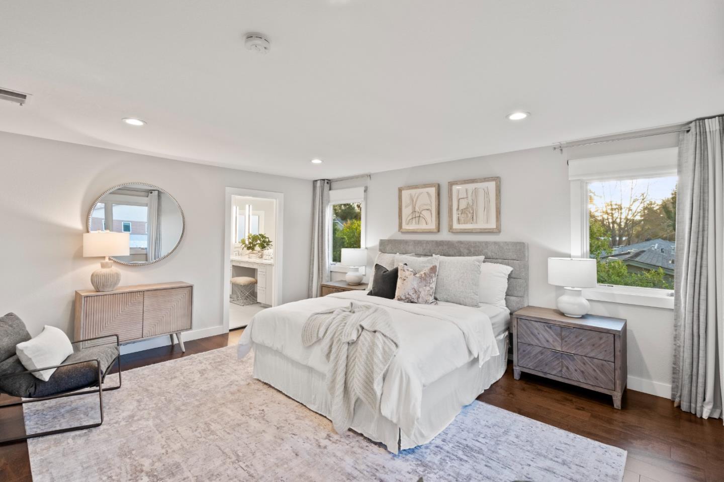 389 Bryant Avenue Mountain View, CA 94040 - Photo 26 of 61 a spacious bedroom with a bed a mirror and a large window