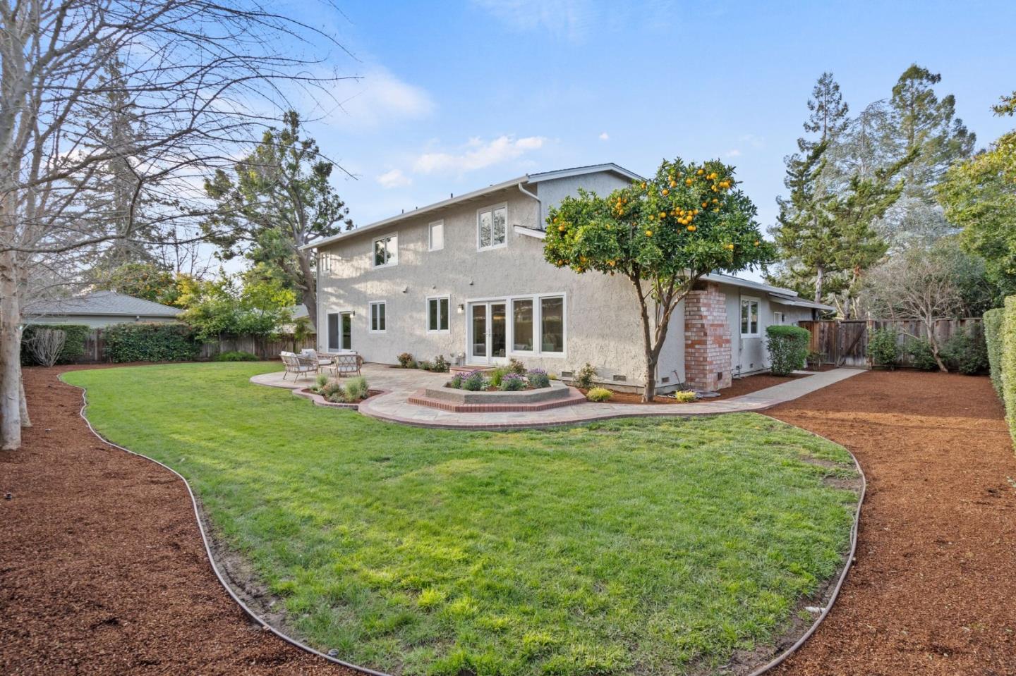 389 Bryant Avenue Mountain View, CA 94040 - Photo 53 of 61 a view of a house with backyard sitting area and garden