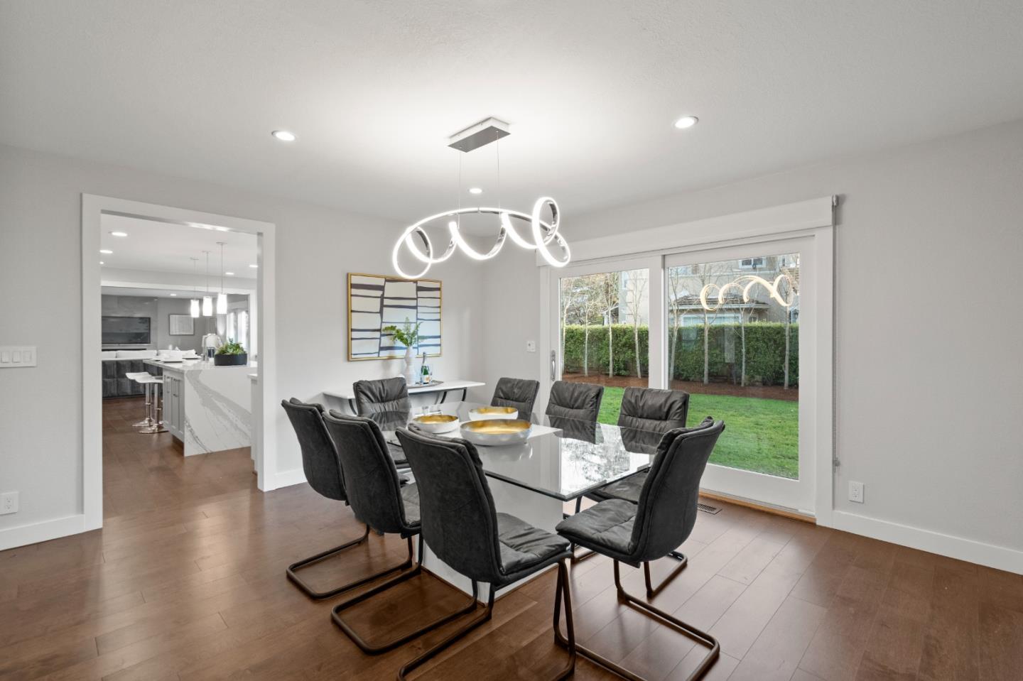 389 Bryant Avenue Mountain View, CA 94040 - Photo 7 of 61 a view of a dining room with furniture window and wooden floor