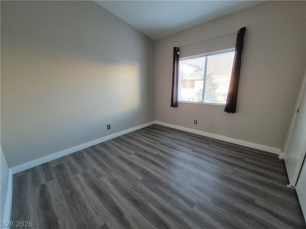 2053 Quarry Ridge Street, Unit 201 Las Vegas, NV 89117 - Photo 3 of 21 A well-proportioned bedroom with ample natural light from its large window.