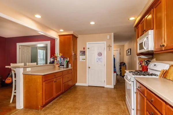 a kitchen with stainless steel appliances granite countertop a stove and a refrigerator