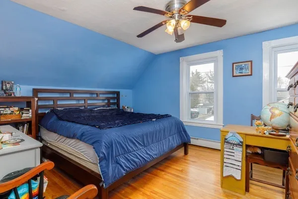 a bedroom with a bed and a table in it
