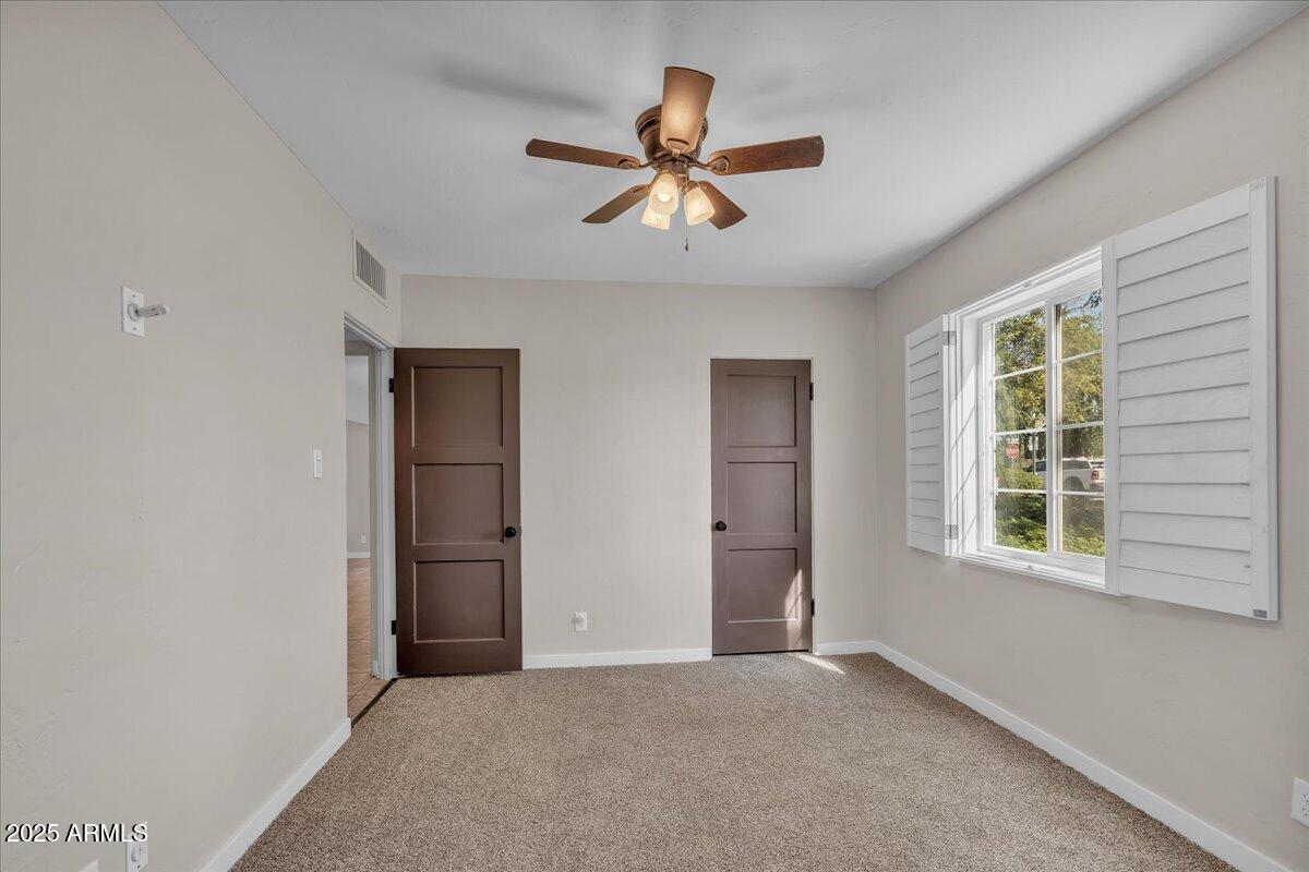 4632 North 14th Street Phoenix, AZ 85014 - Photo 18 of 46 an empty room with closet and windows