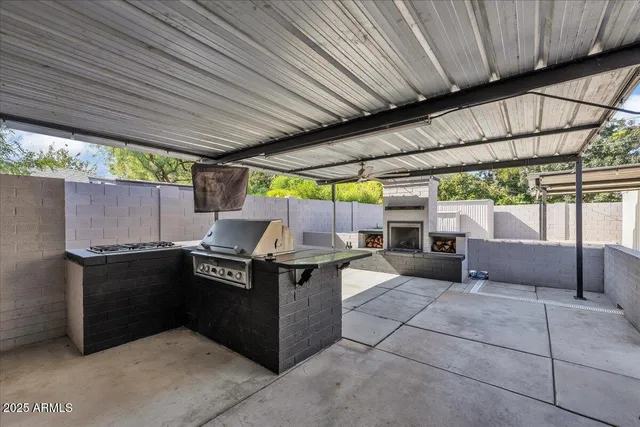 a view of a patio with a table and chairs