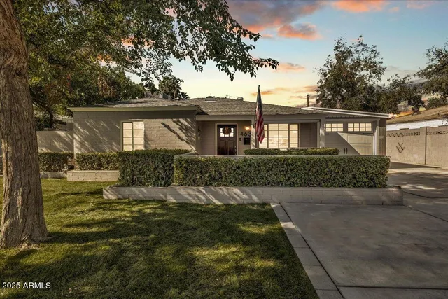 front view of a house with a yard