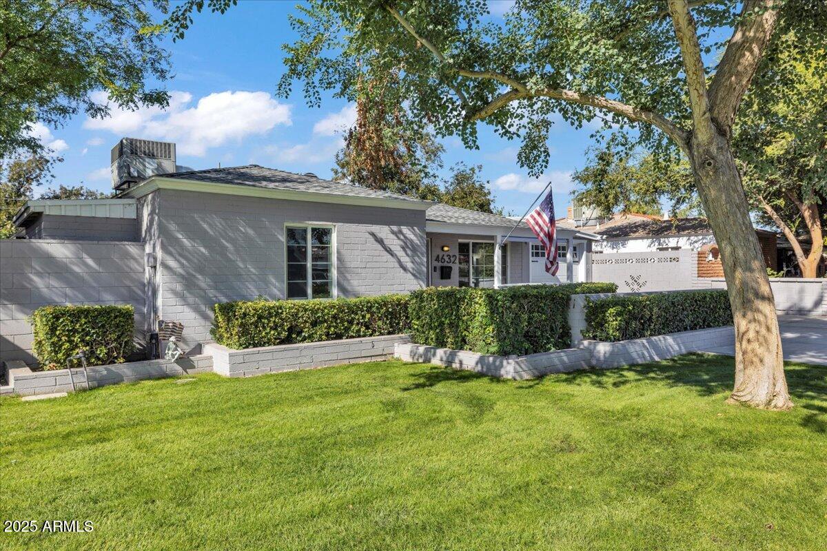 4632 North 14th Street Phoenix, AZ 85014 - Photo 5 of 46 a front view of a house with a yard