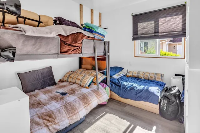 a bedroom with a bed and balcony