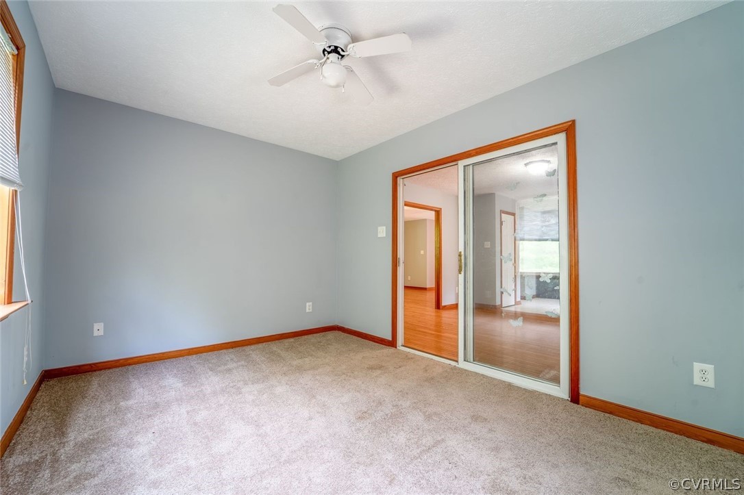 2263 Pony Farm Road Maidens, VA 23102 - Photo 15 of 27 an empty room with fan and windows