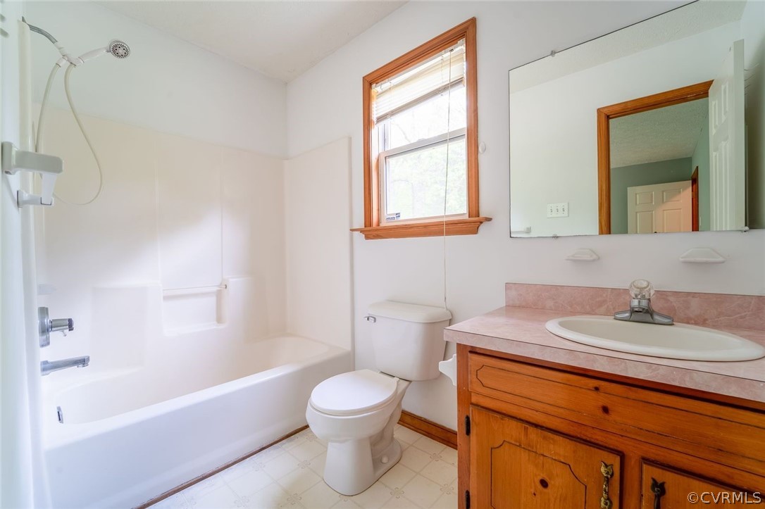 2263 Pony Farm Road Maidens, VA 23102 - Photo 19 of 27 a bathroom with a sink a toilet and a bathtub