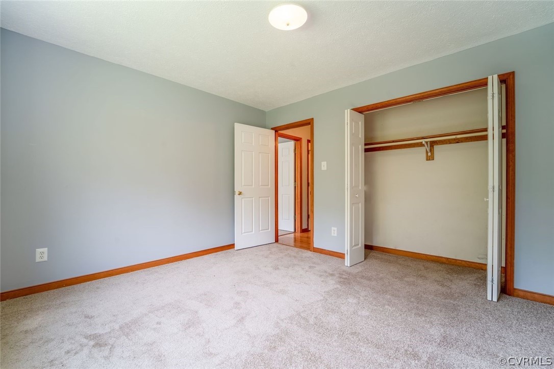2263 Pony Farm Road Maidens, VA 23102 - Photo 21 of 27 an empty room with closet and a window