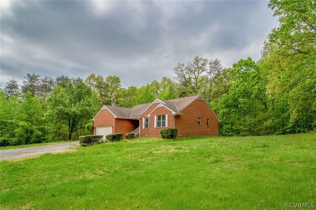 2263 Pony Farm Road Maidens, VA 23102 - Photo 4 of 27 a front view of a house with garden