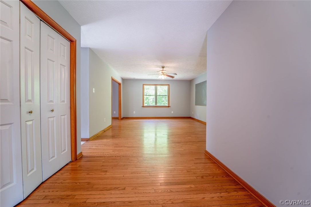 2263 Pony Farm Road Maidens, VA 23102 - Photo 5 of 27 a view of an empty room with window and wooden floor
