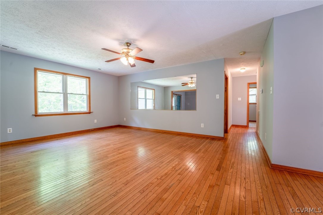 2263 Pony Farm Road Maidens, VA 23102 - Photo 7 of 27 a view of empty room with wooden floor and fan