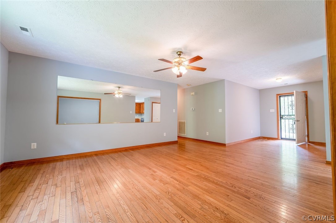 2263 Pony Farm Road Maidens, VA 23102 - Photo 8 of 27 a view of an empty room with window and wooden floor