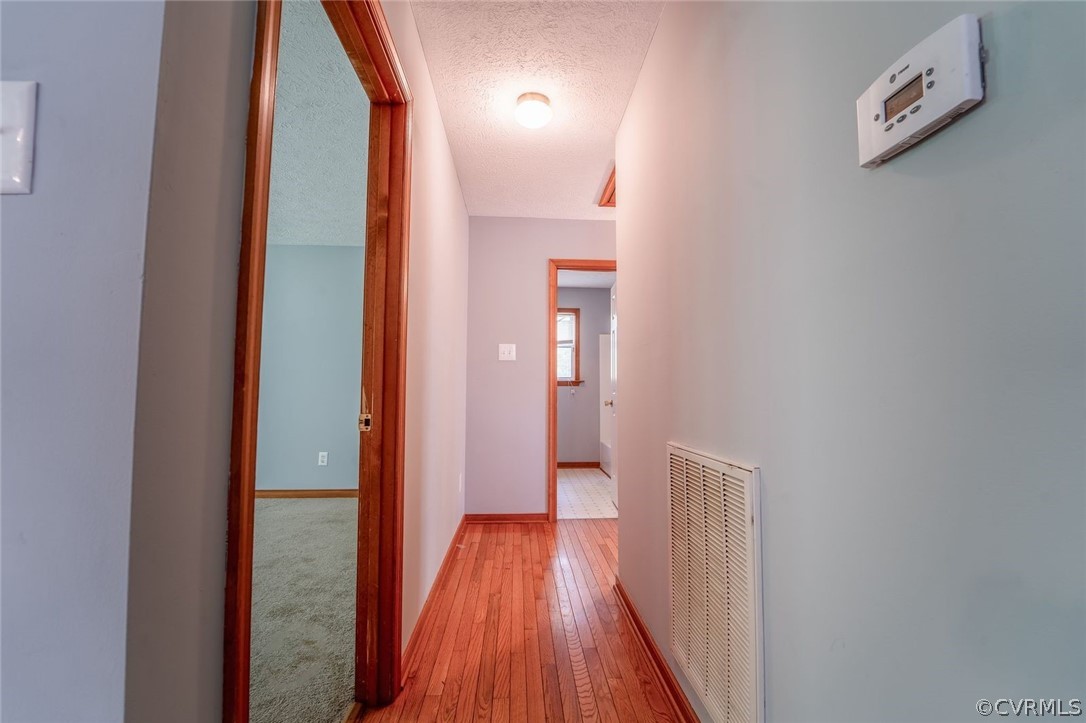 2263 Pony Farm Road Maidens, VA 23102 - Photo 10 of 27 a view of a hallway with wooden floor