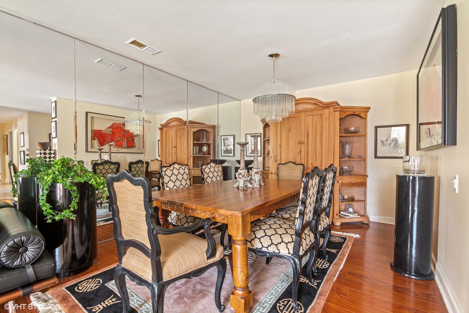 1800 Mission Hills Road, Unit 212 Northbrook, IL 60062 - Photo 3 of 19 a view of a dining room with furniture a chandelier and wooden floor
