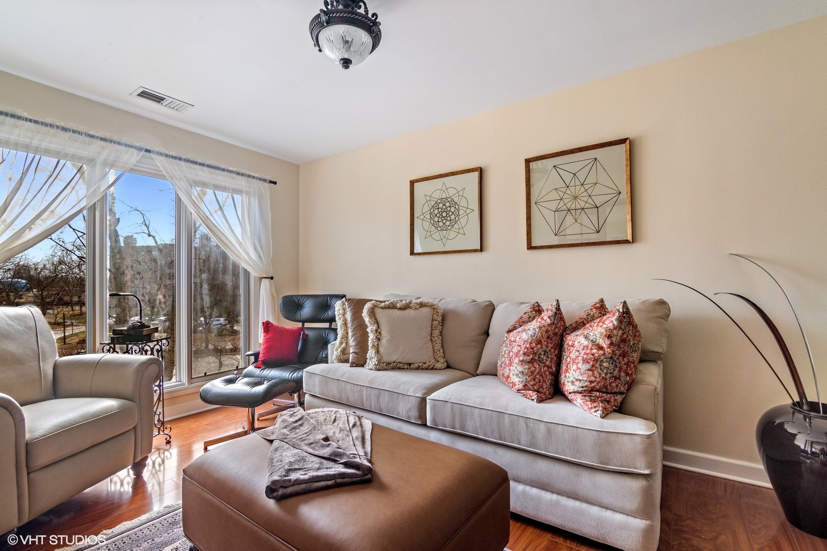 1800 Mission Hills Road, Unit 212 Northbrook, IL 60062 - Photo 5 of 19 a living room with furniture and a large window