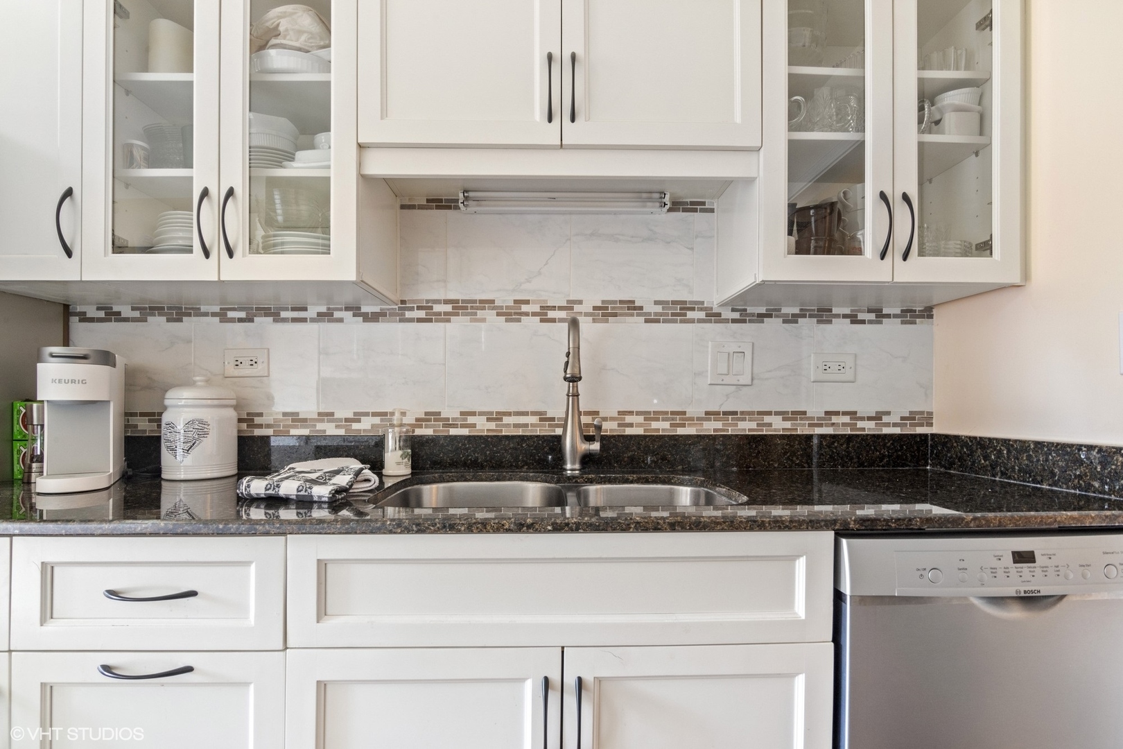 1800 Mission Hills Road, Unit 212 Northbrook, IL 60062 - Photo 7 of 19 a kitchen with granite countertop white cabinets and a stove