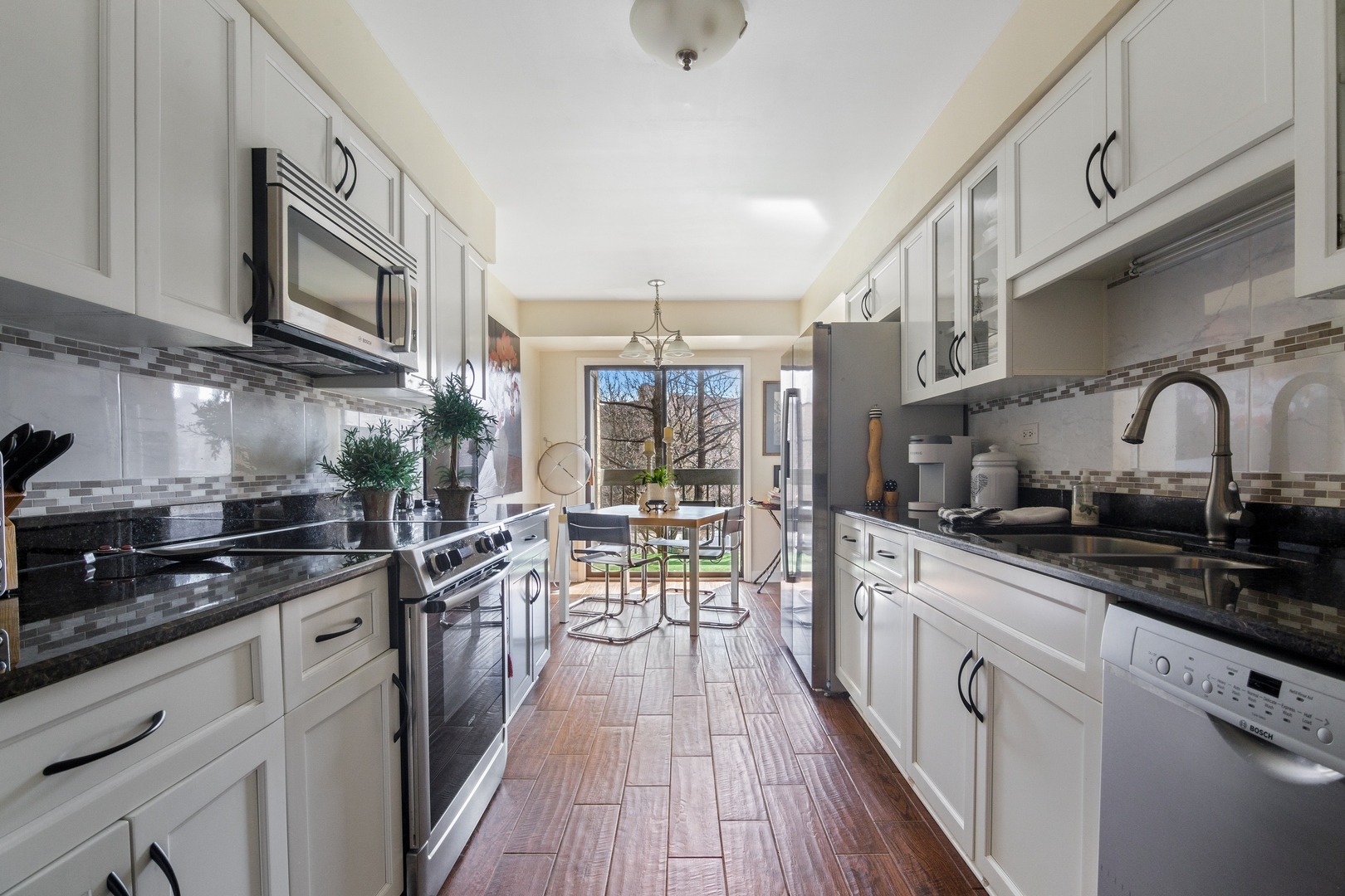 1800 Mission Hills Road, Unit 212 Northbrook, IL 60062 - Photo 9 of 19 a kitchen with lots of counter top space a sink and appliances
