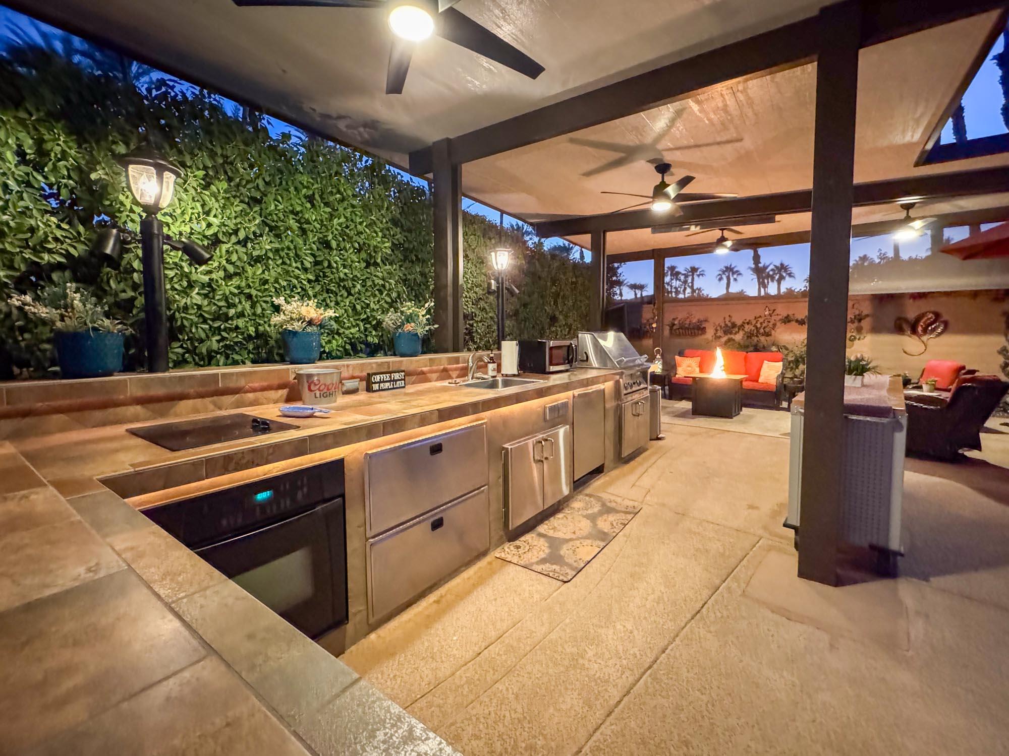 80394 Ave 48, Unit 94 Indio, CA 92201 - Photo 15 of 24 a kitchen with stainless steel appliances kitchen island granite countertop a sink and cabinets