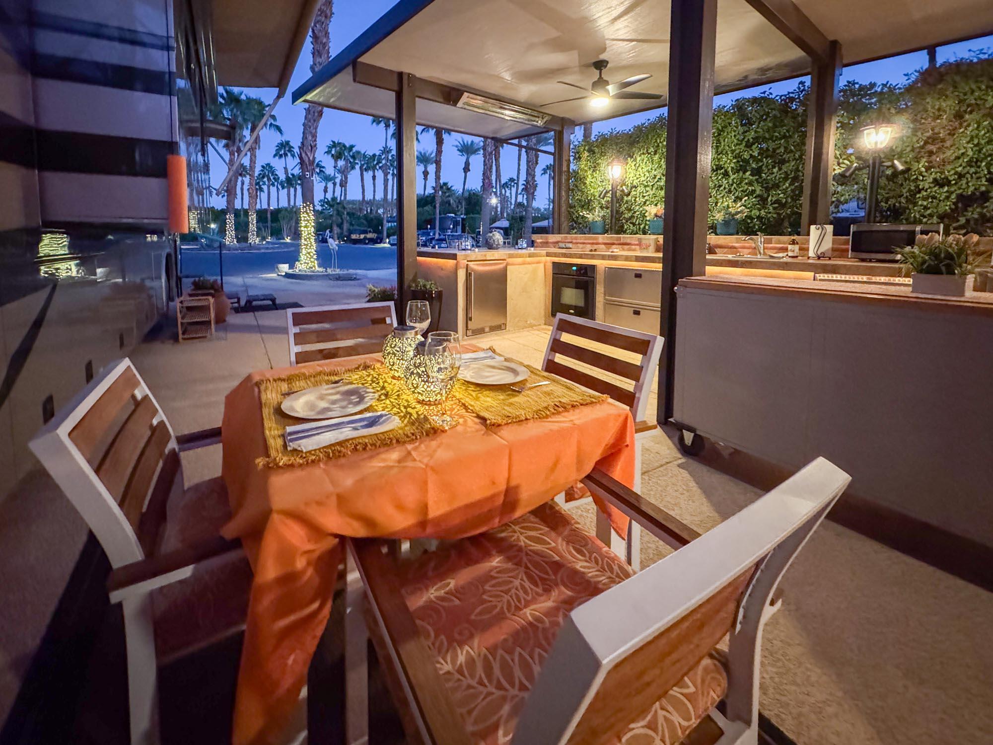 80394 Ave 48, Unit 94 Indio, CA 92201 - Photo 21 of 24 a view of a patio with table and chairs potted plants with floor to ceiling window