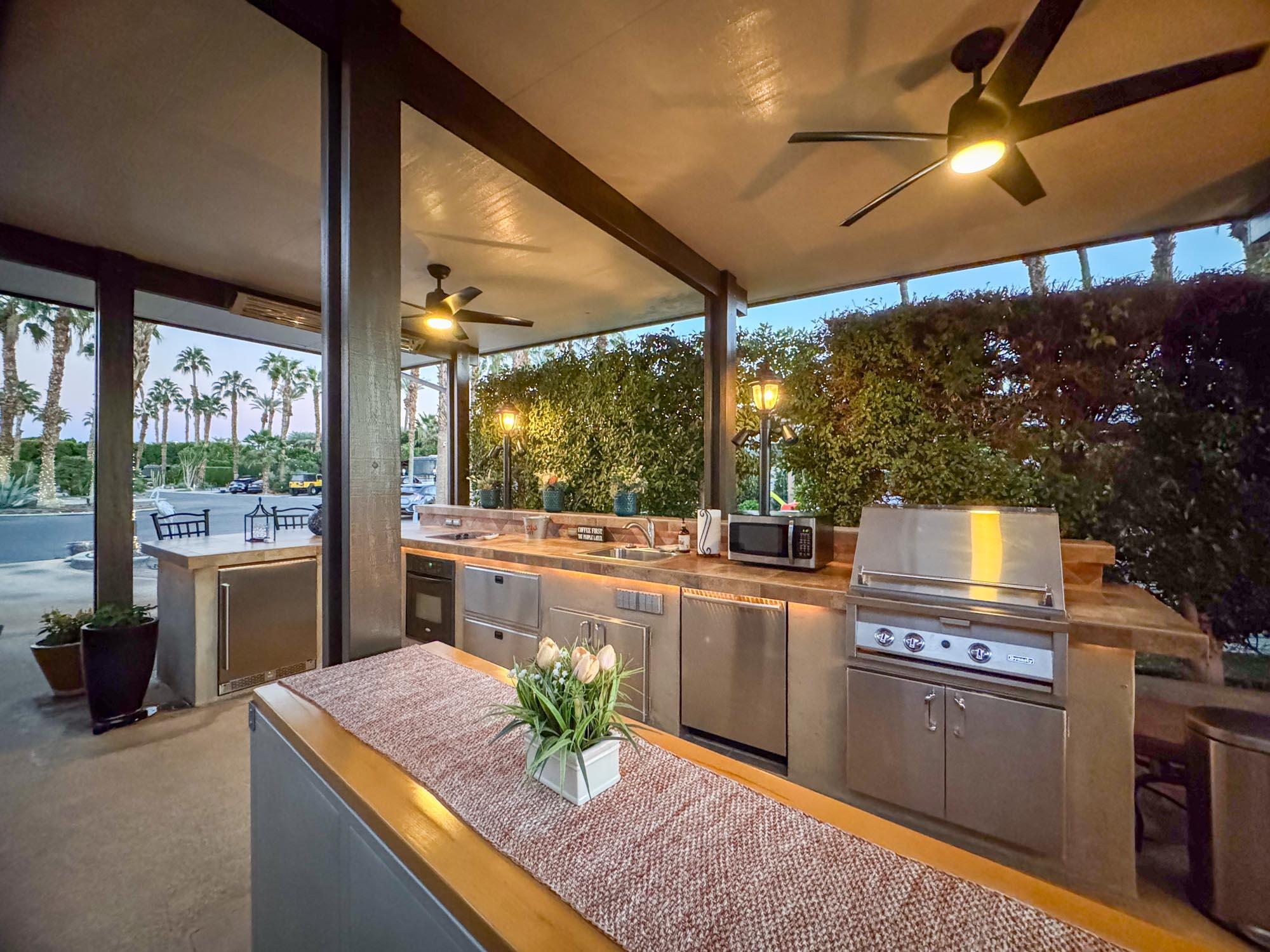 80394 Ave 48, Unit 94 Indio, CA 92201 - Photo 5 of 24 a kitchen with a stove a sink and a refrigerator