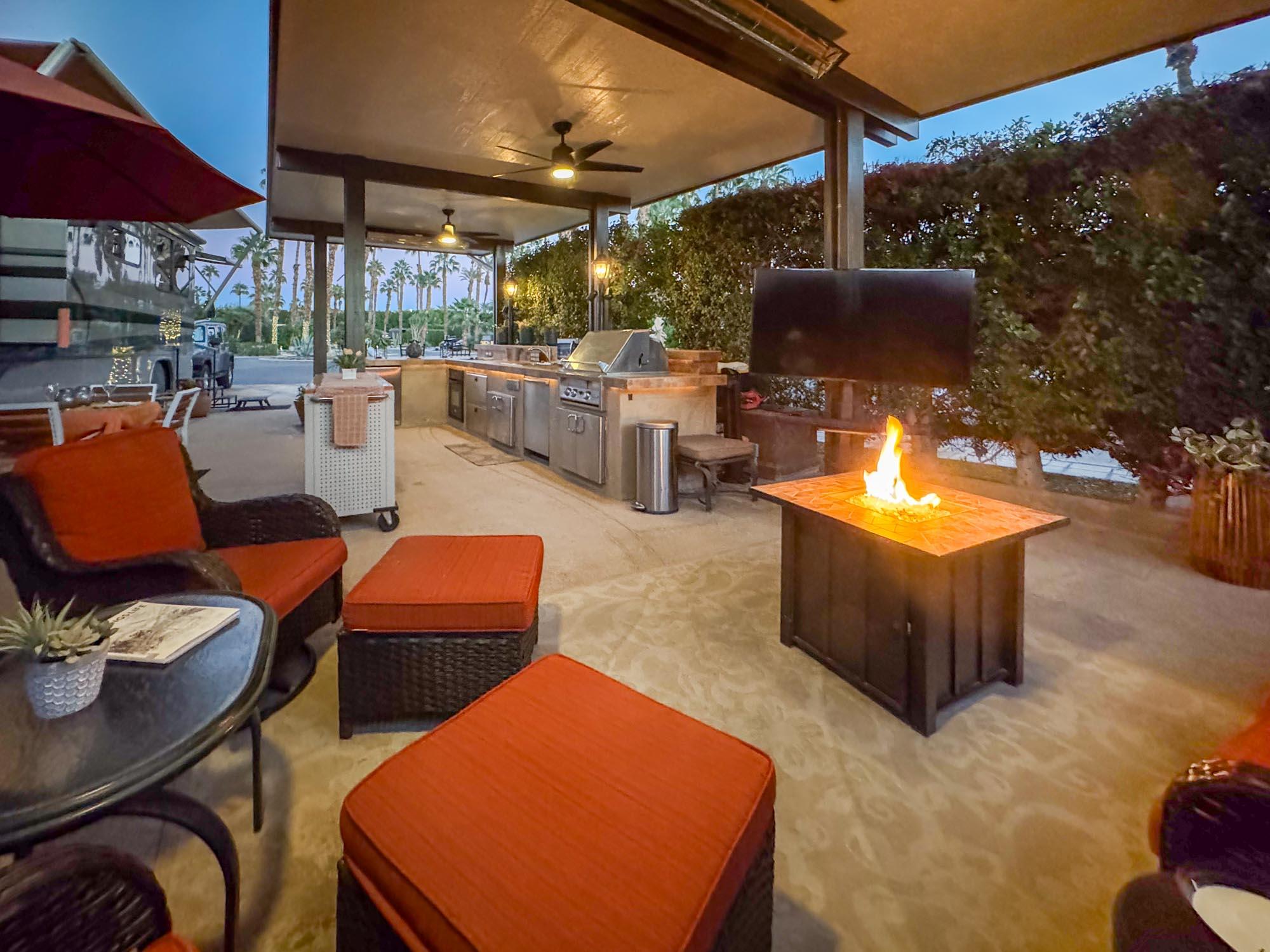 80394 Ave 48, Unit 94 Indio, CA 92201 - Photo 7 of 24 a outdoor space with chairs a fire pit and a table