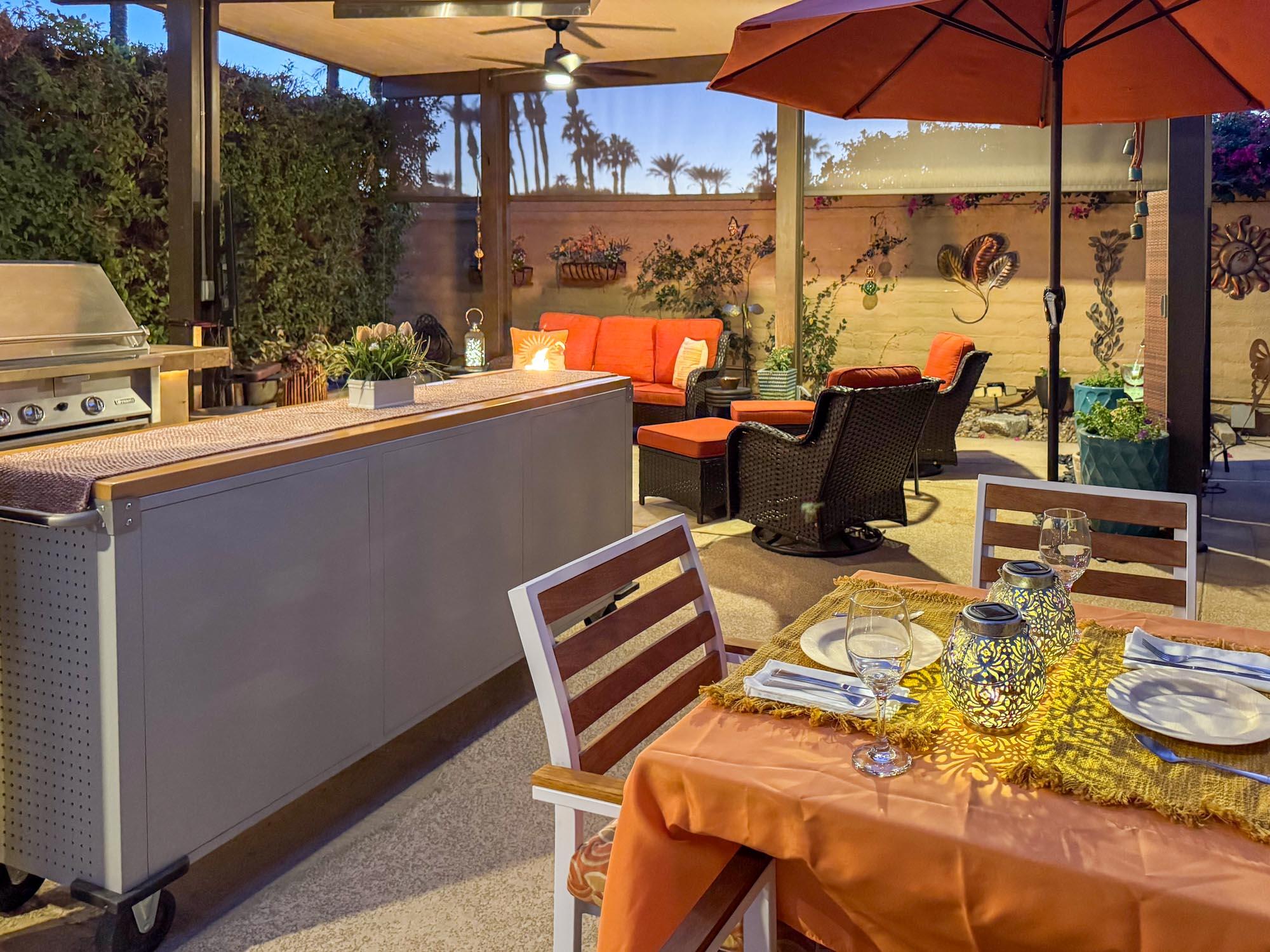 80394 Ave 48, Unit 94 Indio, CA 92201 - Photo 10 of 24 a roof deck with table and chairs under an umbrella