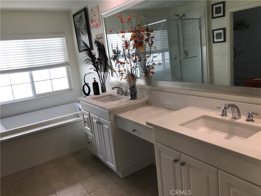 12045 Tributary Way Jurupa Valley, CA 91752 - Photo 3 of 11 a bathroom with a sink double vanity and a mirror
