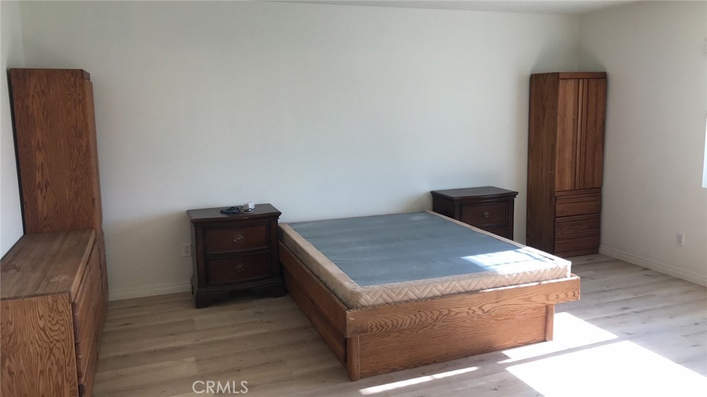 12045 Tributary Way Jurupa Valley, CA 91752 - Photo 4 of 11 a room with a bed