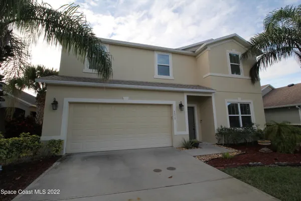 a front view of a house with a garage