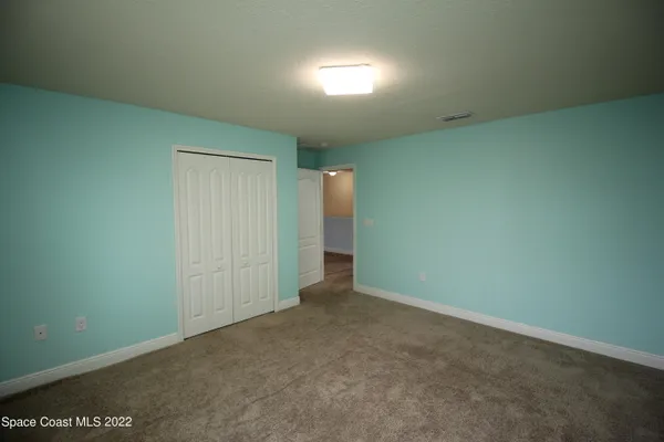an empty room with an empty space and a window