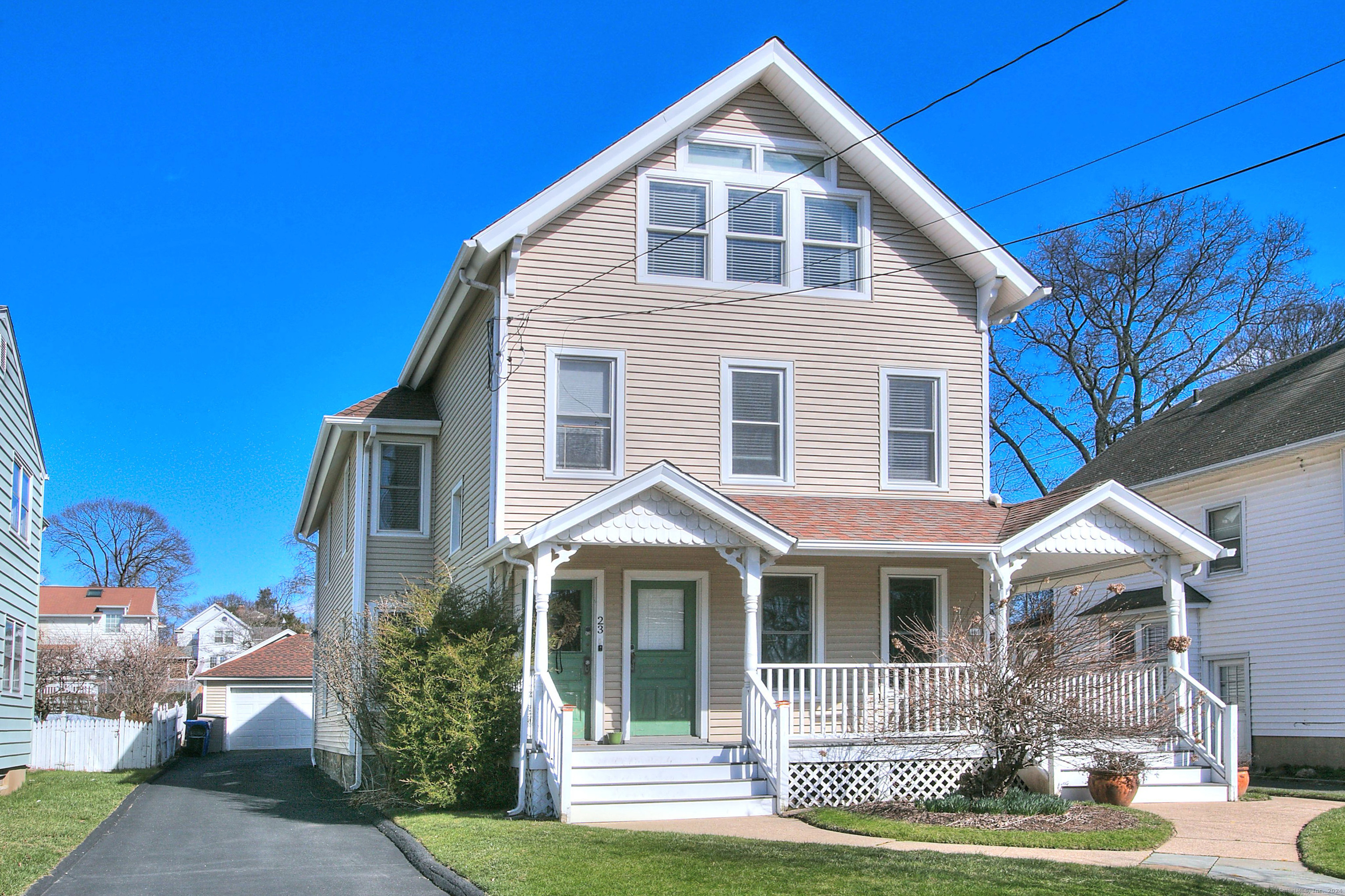 23 Gregory Boulevard, Unit 2 Norwalk, CT 06855 - Photo 1 of 1 a front view of a house with a yard