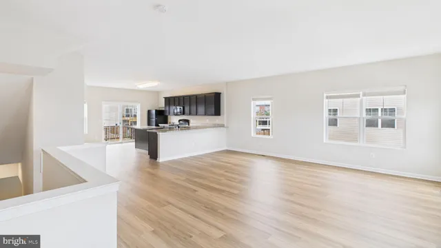 a view of a kitchen with microwave and cabinets