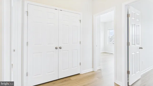 a view of a room with wooden floor