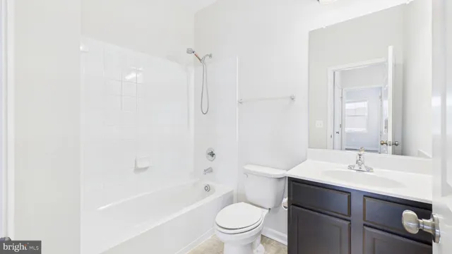 a bathroom with a sink a toilet and a bathtub