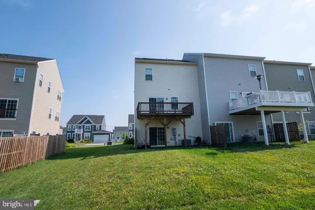a view of house with backyard and entertaining space