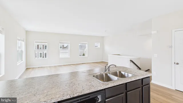 a kitchen with a sink and a refrigerator