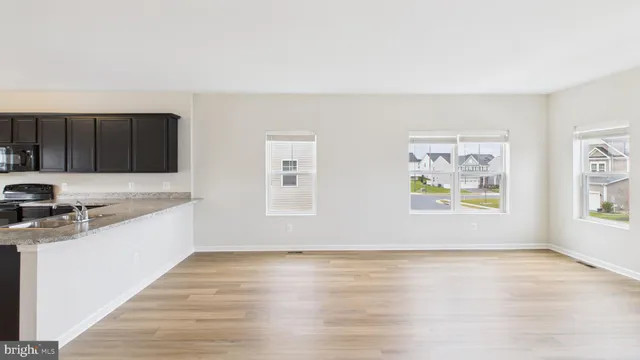 a view of a kitchen with electric appliances