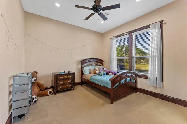 a bedroom with furniture and a window