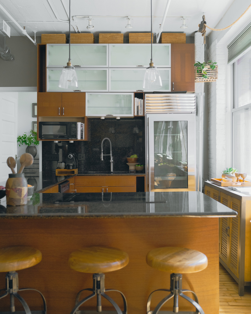 727 South Dearborn Street, Unit 910 Chicago, IL 60605 - Photo 12 of 37 a kitchen with a table chairs and a fireplace